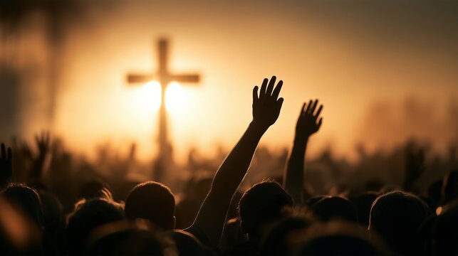 Crowd gathers for worship service with raised hands at sunset under cloudy sky