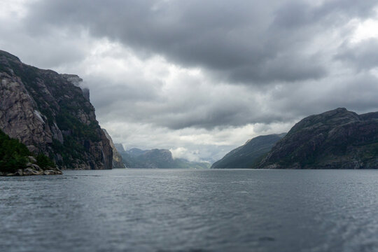 Lysefjord mountains and water under cloudy sky in Rogaland, Norway