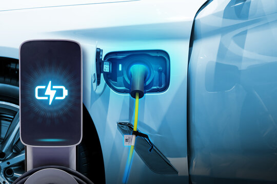 Power cable pump plug in charging power to electric vehicle EV car.