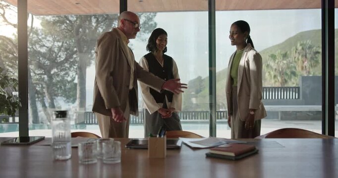 Business, people and meeting with handshake in boardroom for onboarding agreement or partnership. Group, employees or colleagues shaking hands with introduction or greeting for company merger or b2b