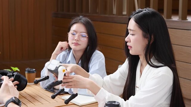 Thai Engineers Testing Robotic Dog Prototype in Bangkok Startup Office