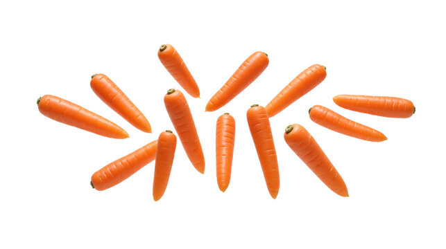 Whole carrots falling in the air, isolated on transparent background