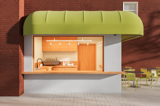 Exterior cafe kiosk with green awning, open service window, tiled counter, outdoor seating, and warm brick facade in sunlight. 3D Rendering