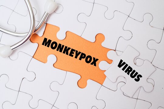 Stethoscope on puzzle with "MONKEYPOX VIRUS" text. Representing medical research, disease solution, outbreak diagnostic, and healthcare concept