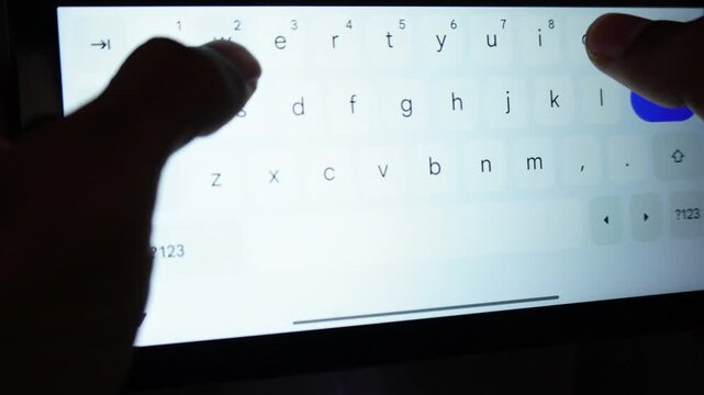 Close Up of Hands and Thumbs Fast Typing on Digital Virtual Qwerty Keyboard on Smartphone