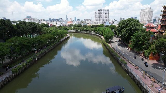  4k Aerial Drone shot of a beautiful pagoda Vinh Nghiem a Buddhist temple in Ho Chi Minh city next to a river canal in Vietnam