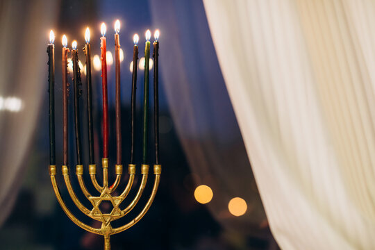 Hanukkah menorah with burning candles celebrating jewish holiday