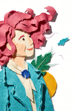Woman with colorful hair and green leaves in a playful paper illustration  