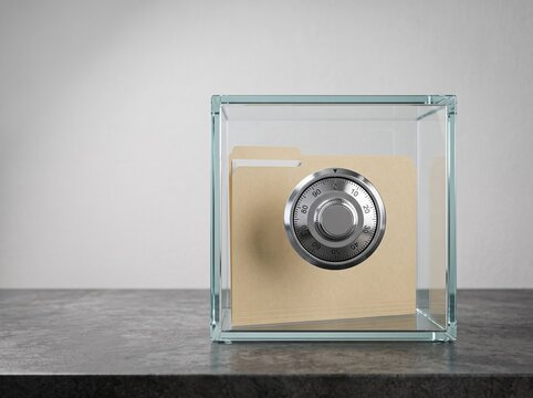 Manila paper file folder inside a glass box with safe dial lock