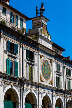 Torre dell'Orologio and its Italian Renaissance astronomical clock, based on Ptolemy's geocentric theories, overlooking the Piazza della Loggia in Brescia