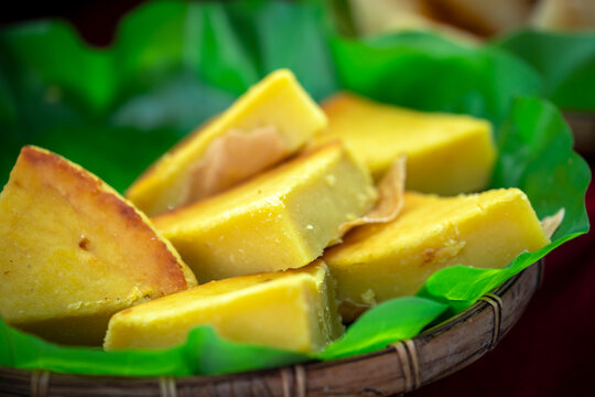 Traditional Banh Dau Xanh Nuong, a rustic Southern Vietnamese baked mung bean cake made from rice flour, sugar, and ground mung beans.