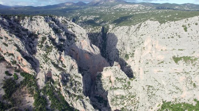 High aerial view of the Gorropu Gorge canyon , an impressive limestone gorge located in the Supramonte mountain range in Sardinia, Italy