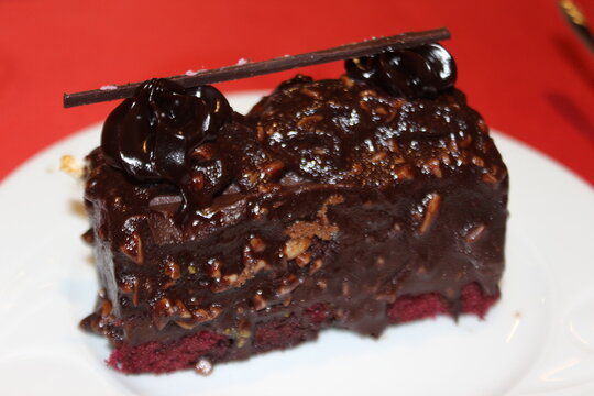 piece of chocolate cake with cherries