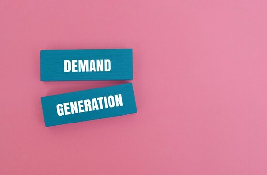 A coloured blocks with text "DEMAND GENERATION" over pink background. Business marketing concept