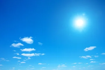 Sun shining in blue sky. Sunny background. Blue sky background. © Pakhnyushchyy
