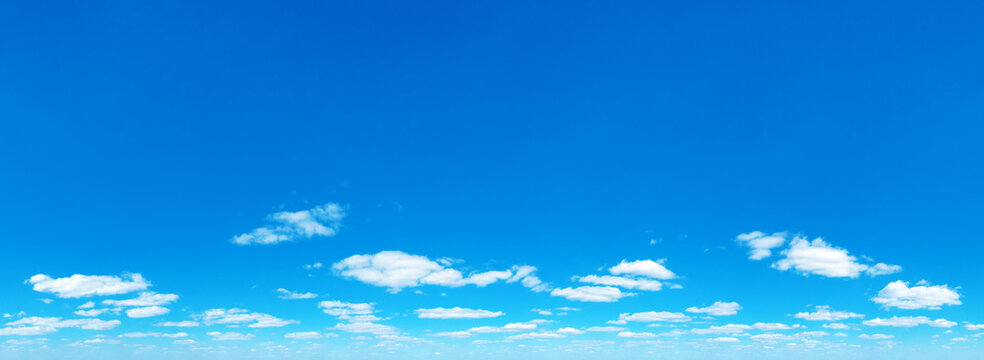 Blue Sky background with tiny Clouds. Panorama background