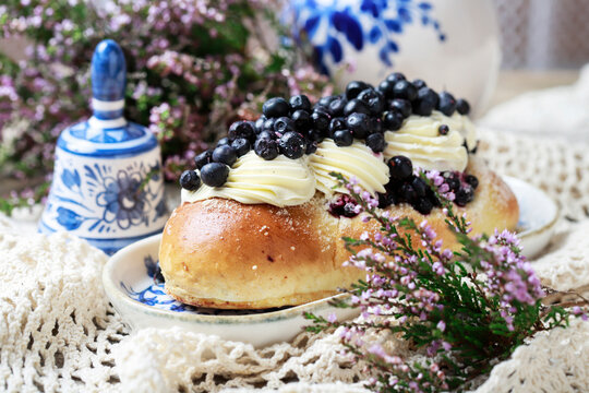 Delicious sweet yeast bun filled with smooth custard cream and topped with fresh blueberries.