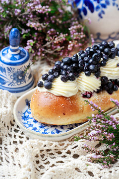 Delicious sweet yeast bun filled with smooth custard cream and topped with fresh blueberries.