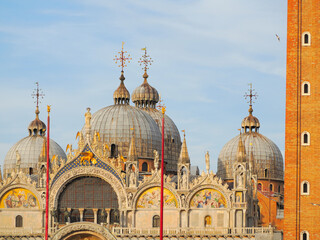 Ornate Byzantine domes and facade of St Mark's Basilica with campanile tower in Venice © Konstantinos
