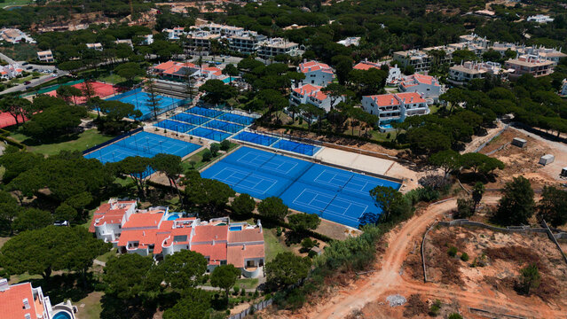 Aerial drone footage, shooting the tourist village of Vale de Lobo, on the shores of the Atlantic Ocean, golf courses for tourists. Portugal, Algarve.