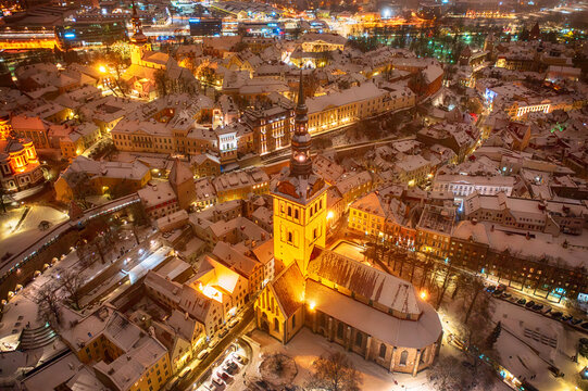 Aerial night View of Tallinn in winter, roofs are covered with snow, Christmas mood