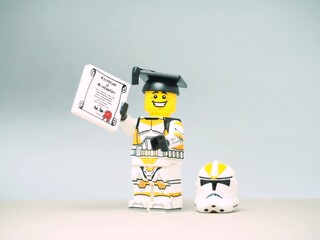 Obraz premium Indonesia - September 11, 2023 : Mini toy at table with blurred background. Graduation party concept design.