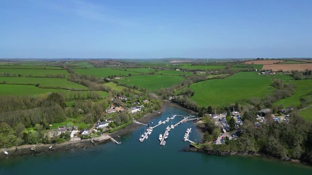 River Fowey, Cornwall, England: DRONE VIEWS: A high angle shot of Penmarlam marina, just north of the town of Fowey, and the surrounding countryside. Cornwall is a popular UK holiday destination.