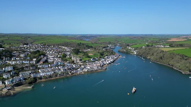 Fowey, Cornwall, England: DRONE VIEWS: Descending over the River Fowey for a view of the town of Fowey. Fowey is a popular UK holiday destination and an important port for the export of china clay.