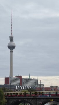 Berlin TV Tower with S-Bahn train crossing the Spree
