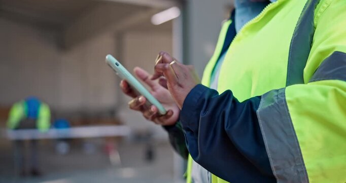 Architect, hands and typing with phone on construction site for building discussion or conversation. Person, contractor or civil engineer chatting with network or app for mobile texting or connection