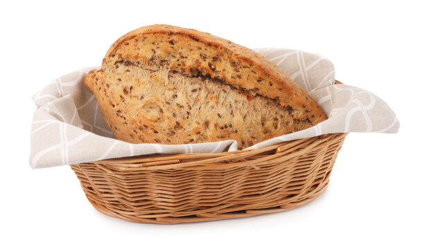 Loaf of fresh bread in wicker basket isolated on white