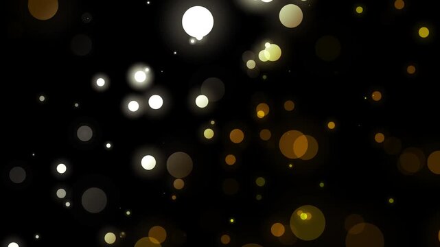 Gold bokeh particles floating on black background, shimmering golden glitter dust and soft glowing light circles, abstract festive sparkle motion background on seamless  loop video animation. 4K