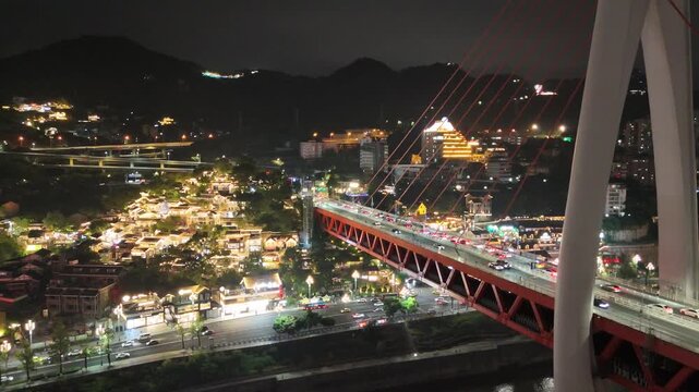 Chongqing, China, aerial drone view nightscape with Dongshuimen Yangtze bridge