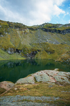B&acirc;lea Lake surrounded by the Carpathian Mountains along the Transfăgărășan Road in Romania, scenic alpine landscape and popular travel destination.