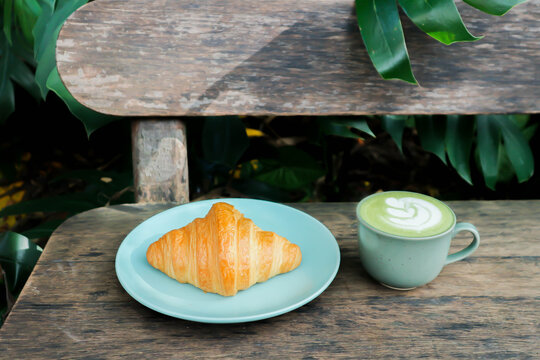 croissant , French croissant or French bread and green tea or matcha green tea, milk green tea or matcha latte or matcha green tea latte