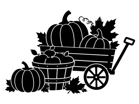 Black and white autumn harvest wagon filled with pumpkins and barrels on rustic road