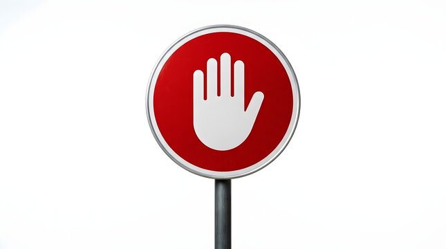 Red circular traffic sign featuring a white palm print to signal halt or prohibition  affixed to a metal post on a neutral backdrop