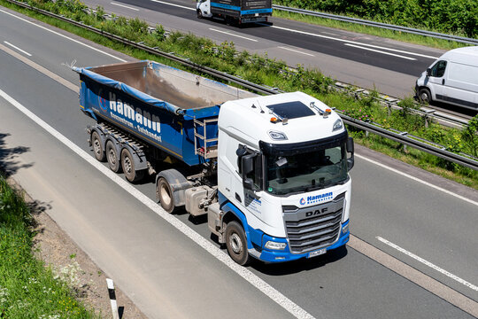 Wiehl, Germany - May 26, 2026: Hamann Bauzentrum DAF XF truck with tipper trailer on motorway