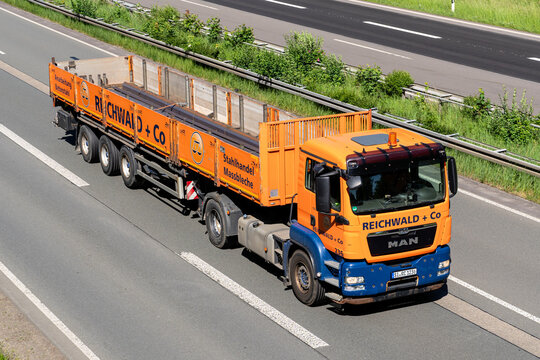 Wiehl, Germany - May 26, 2026: Reichwald + Co MAN TGS truck with flatbed trailer on motorway