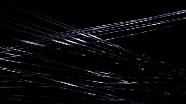 Thin Metallic Lines Crossing and Reflecting Light on Dark Background