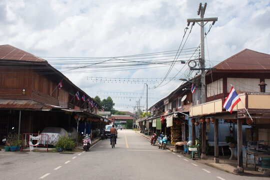 Ancient wooden shophouses along the street of Baan Wang Krot Old Community or antique village of Yaan Wangkrod Old Market for thai people travelers travel visit on August 1, 2026 in Phichit, Thailand