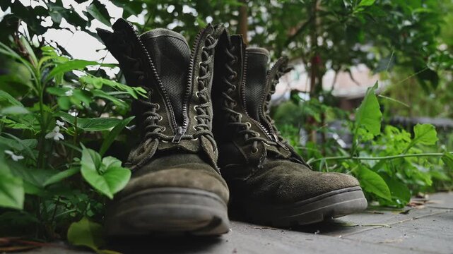 Worn Taiwanese Military Boots on Grass with Weathered Texture