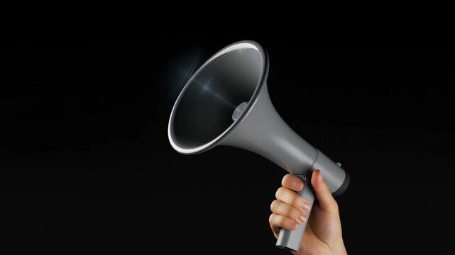Hand Holding a Megaphone Up Against a Solid Black Background