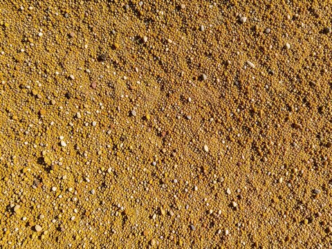 Compacted Decomposed Granite Gravel Surface Texture Background with Warm Earth Tones