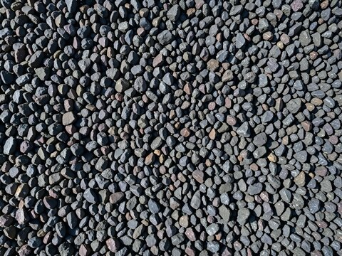 Sharp Angular Dark Basalt Chips Crushed Gravel Surface Texture Background
