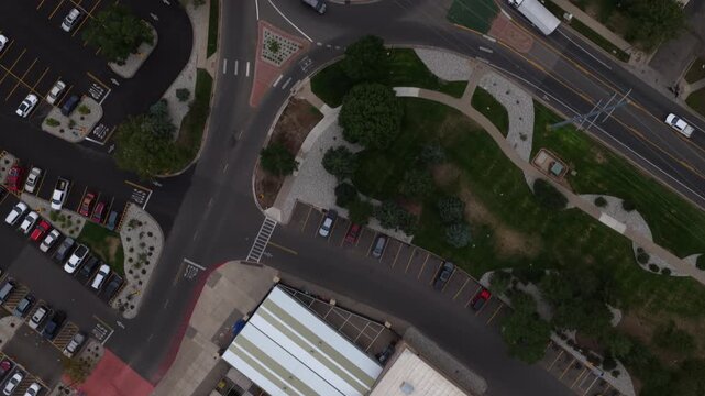 Top down aerial of commercial area and roads with roundabout in Loveland Colorado during summer day time