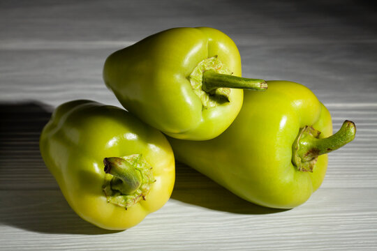 green pepper on grey wood background