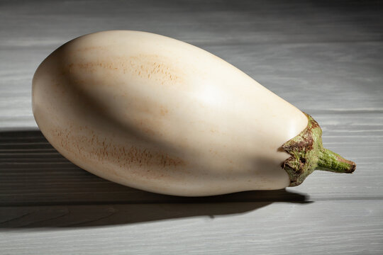 white eggplant on grey wood background