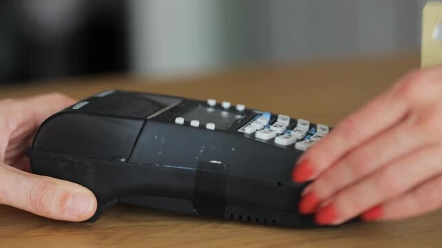 Female Customer Using Bank Card Payment Machine for Purchase