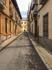 Fototapeta premium Narrow historic street with colorful facades